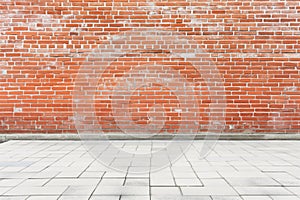 Red brick wall with white pavement