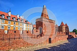 Red brick walls and towers of Warsaw Barbican, Poland photo