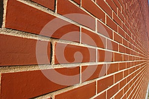 Red bricked wall in perspective