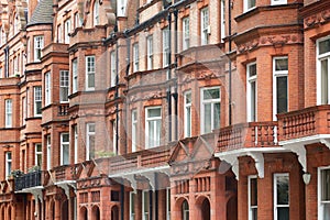 Red bricks english houses facade in London