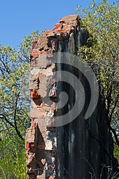 RED BRICKS EXPOSED IN REMNANT WALL OF RUINS