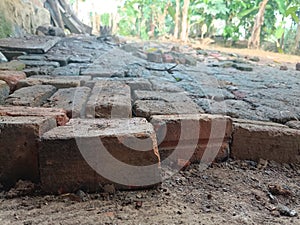 Red bricks lined the ground lying outside the house