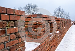 Red bricks wall of the historic castle in Old Town of Warsaw, Poland