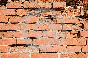 Red bricks wall ruin texture. Broken bricks