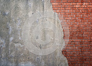 Red brickwork underneath concrete wall