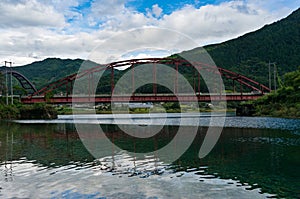 Red bridge across Kiso river, Japan