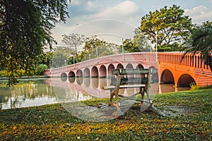 Red bridge in  Chatuchak Park Bangkok Thailand