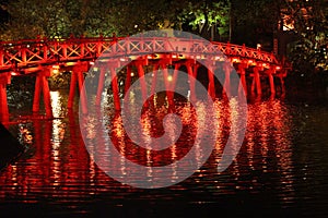 Red Bridge glistening in the waster at Hanoi Vietnam