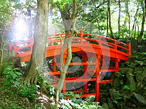 A red bridge in a Japanese garden inside Tokyo