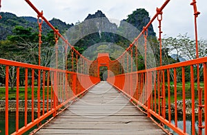 Red bridge over song river, vang vieng, laos photo