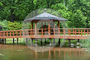 Red bridge with a view pavilion, yumedono bashi, in japanese gar