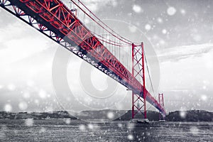 Red Bridge in winter snow. Lisbon, Portugal