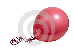 Red bright rubber balloon isolated on the white background