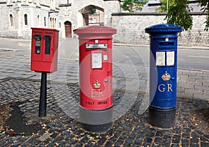 Red British mail box on a city street
