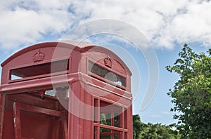 Red British pay phone booth outdoors