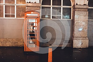 Red British Telephone Booth on a city street