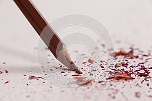 Red broken colored pencil on white background