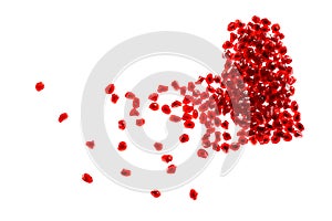 Red broken heart shape made of pomegranate seeds