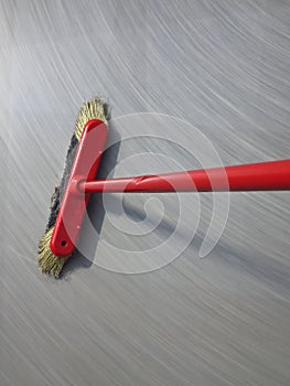 Red broom sweeping