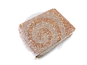 Red brown rice in vacuum package on white background