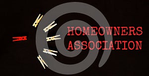 Red and brown text Homeowners Association on the black background