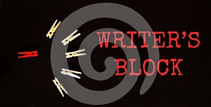 Red and brown text Writer S Block on the black background