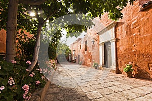 Red buildings and garden with flowers in arequipa monastery