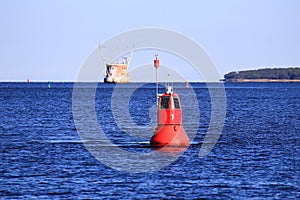 Red buoy in the Batlic Sea on a sunny day