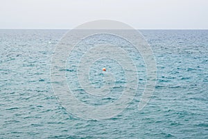 Red Buoy Floating in a Mediterranean Sea