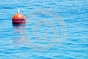 red buoy floating in the sea