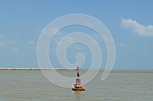 Red buoy floating in the sea