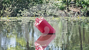 Red buoy in a large pond
