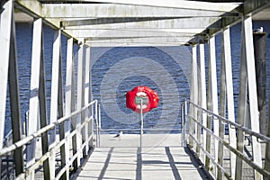 Red buoy life safety ring at boat marina