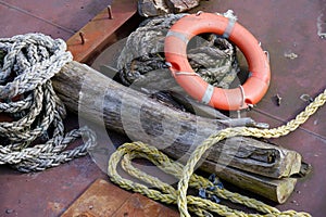 Red buoy life safety ring on pontoon and safety rope