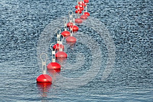 Red buoy for mooring boats on the water
