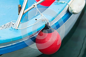 Red buoy for protecting moored yachts in marina