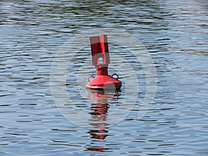 Red buoy in river