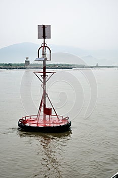 Red buoy with solar panel