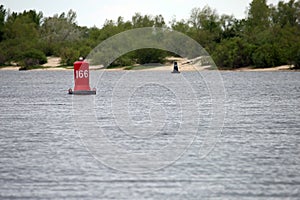 Red buoy on the water in the river