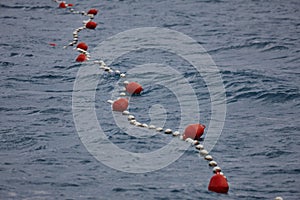 Red buoys in the sea to separate zones