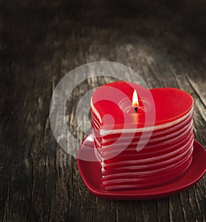 Red burning heart shaped candles