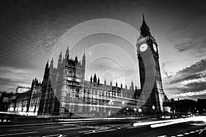 Red bus, Big Ben and Westminster Palace in London, the UK. at night. Black and white