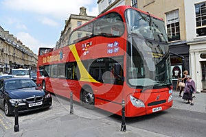 Red Bus Carries Passengers in Bath England