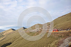 Red Bus on Cliff
