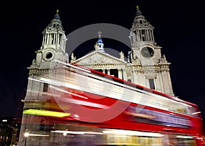 Red bus passing St- Paul's cathedral