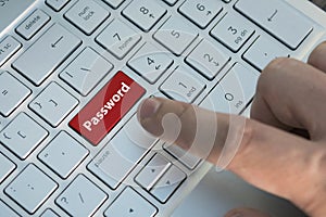 Red button on the keyboard, access concept. Password inscriptions on the grey silver keyboard button close up.
