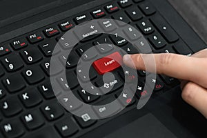 Red button `Learn` on keyboard
