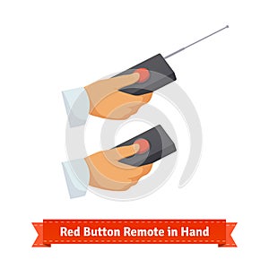 Red button remote control with antenna in hand