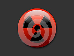 Red button with symbol of radioactivity and radioactive radiation
