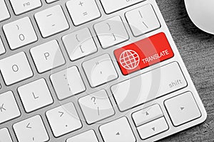 Red button with word TRANSLATE on computer keyboard, closeup view